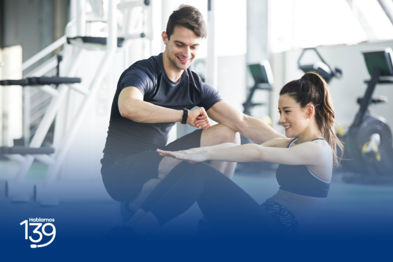 young-woman-working-with-trainer-at-gym-edit